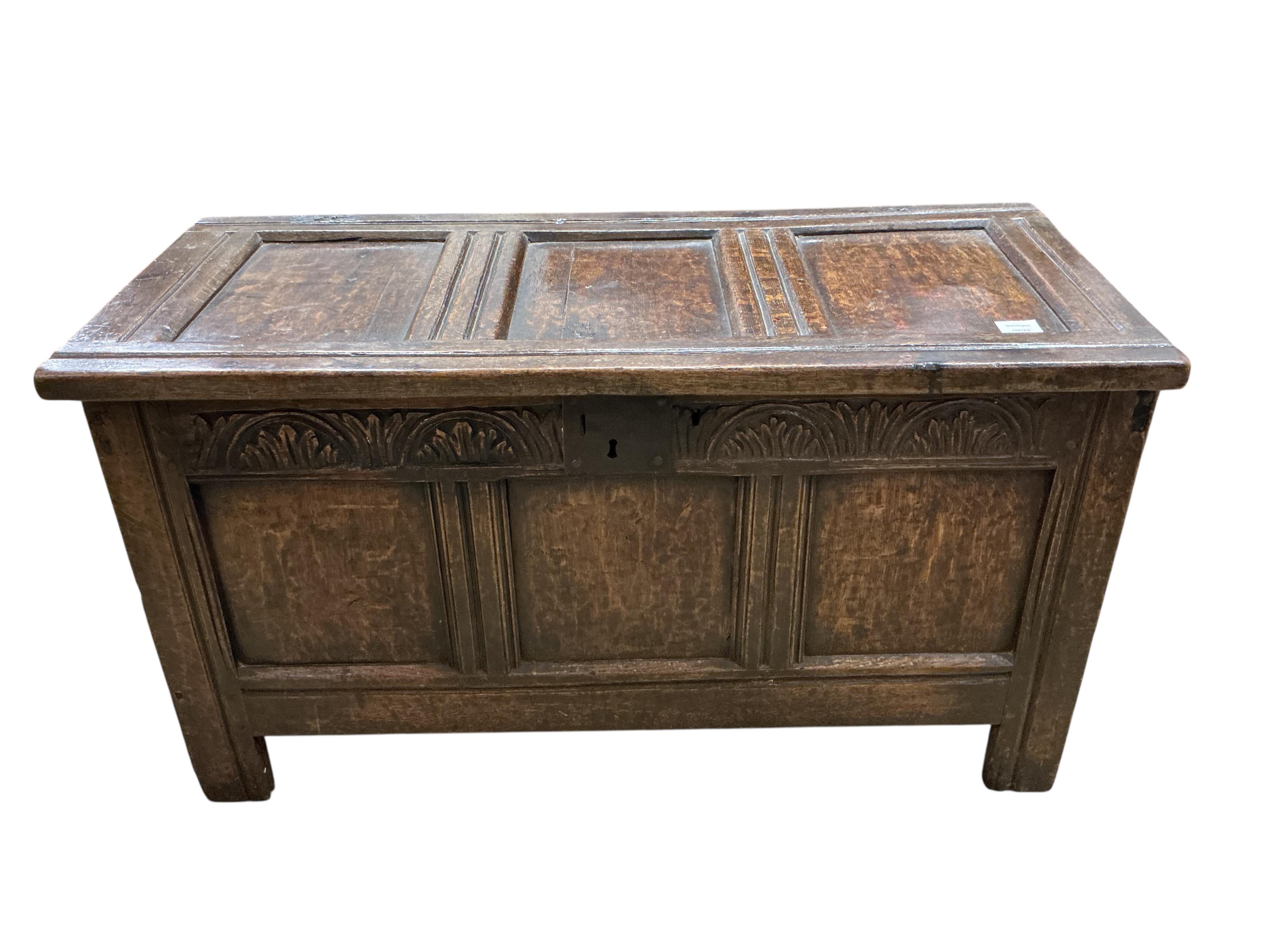 A small 17th century oak triple panelled coffer, width 106cm, depth 46cm, height 59cm